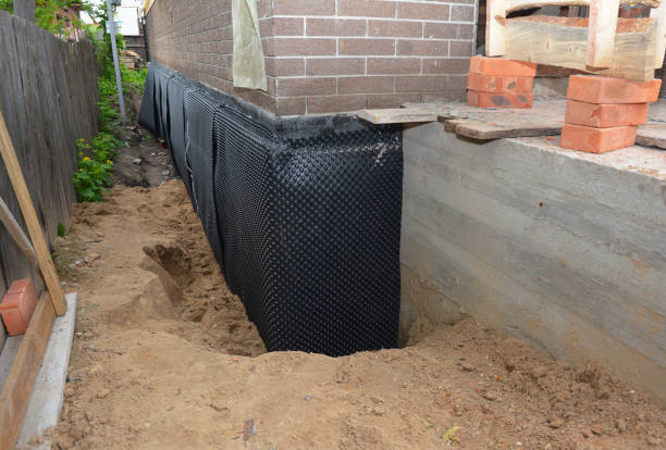 Happy homeowners after waterproofing job in Haskins